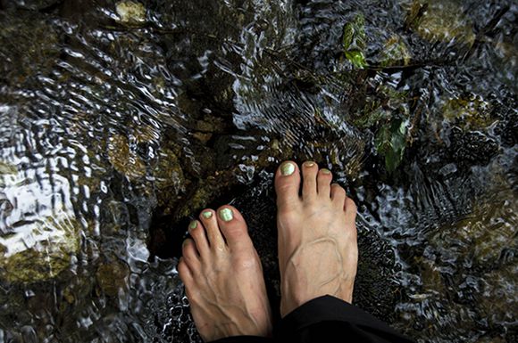 Barefoot by a stream